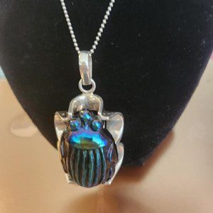 tiffany favrille glass scarab mounted in sterling silver.